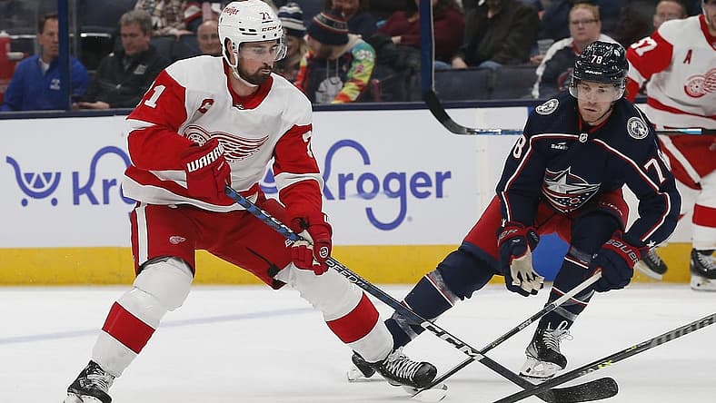 Oct 16, 2023; Columbus, Ohio, USA; Columbus Blue Jackets defenseman Damon Severson (78) defends against Detroit Red Wings center Dylan Larkin (71) during the first period at Nationwide Arena. Mandatory Credit: Russell LaBounty-USA TODAY Sports