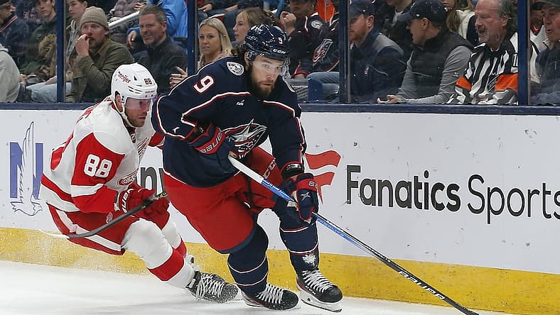 Oct 16, 2023; Columbus, Ohio, USA; Columbus Blue Jackets defenseman Ivan Provorov (9) carries the puck away from Detroit Red Wings right wing Daniel Sprong (88) during the first period at Nationwide Arena. Mandatory Credit: Russell LaBounty-USA TODAY Sports
