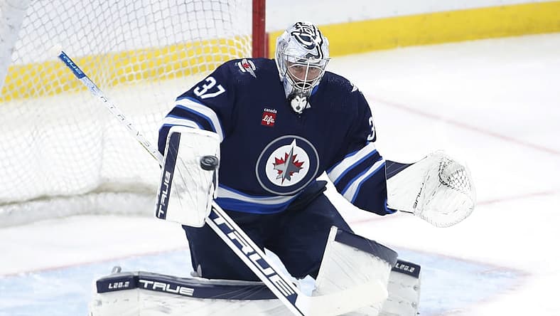 Oct 17, 2023; Winnipeg, Manitoba, CAN; Winnipeg Jets goaltender Connor Hellebuyck (37) warms up before a game against the Los Angeles Kings at Canada Life Centre. Mandatory Credit: James Carey Lauder-USA TODAY Sports