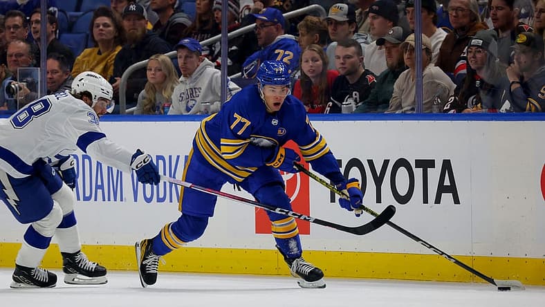 Oct 17, 2023; Buffalo, New York, USA; Tampa Bay Lightning left wing Brandon Hagel (38) defends as Buffalo Sabres right wing JJ Peterka (77)looks to make a pass during the first period at KeyBank Center. Mandatory Credit: Timothy T. Ludwig-USA TODAY Sports
