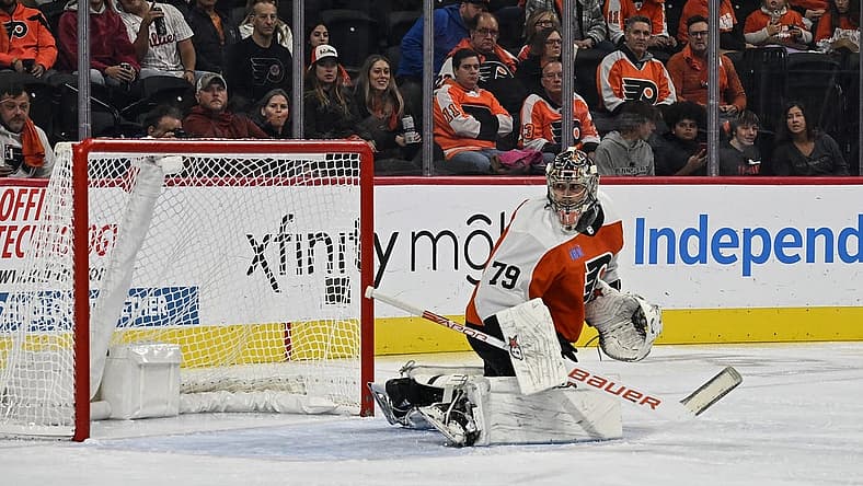 Oct 17, 2023; Philadelphia, Pennsylvania, USA; Philadelphia Flyers goaltender Carter Hart (79) watches as shot goes into the corner in the second period against the Vancouver Canucks at the Wells Fargo Center. Mandatory Credit: John Geliebter-USA TODAY Sports