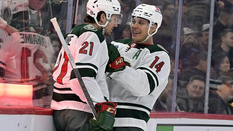 Oct 17, 2023; Montreal, Quebec, CAN; Minnesota Wild forward Brandon Duhaime (21) celebrates with teammate forward Joel Eriksson Ek (14) after scoring a goal against the Montreal Canadiens during the first period at the Bell Centre. Mandatory Credit: Eric Bolte-USA TODAY Sports
