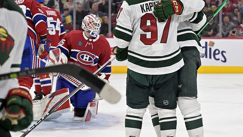 Oct 17, 2023; Montreal, Quebec, CAN; Minnesota Wild forward Joel Eriksson Ek (14) celebrates teammate forward Kirill Kaprizov (97) after scoring a goal against Montreal Canadiens goalie Sam Montembeault (35) during the third period at the Bell Centre. Mandatory Credit: Eric Bolte-USA TODAY Sports