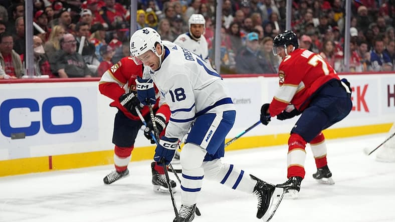Oct 19, 2023; Sunrise, Florida, USA; Toronto Maple Leafs center Noah Gregor (18) plays the puck against the Florida Panthers during the first period at Amerant Bank Arena. Mandatory Credit: Jasen Vinlove-USA TODAY Sports