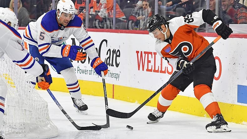 Oct 19, 2023; Philadelphia, Pennsylvania, USA; Philadelphia Flyers right wing Cam Atkinson (89) battle for the puck with Edmonton Oilers defenseman Cody Ceci (5) during the third period at Wells Fargo Center. Mandatory Credit: Eric Hartline-USA TODAY Sports