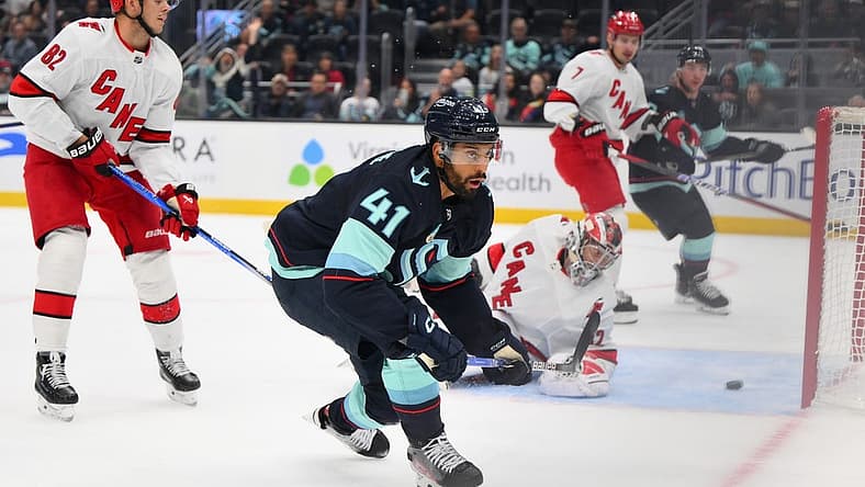 Oct 19, 2023; Seattle, Washington, USA; Seattle Kraken left wing Pierre-Edouard Bellemare (41) scores a goal past Carolina Hurricanes goaltender Antti Raanta (32) during the first period at Climate Pledge Arena. Mandatory Credit: Steven Bisig-USA TODAY Sports