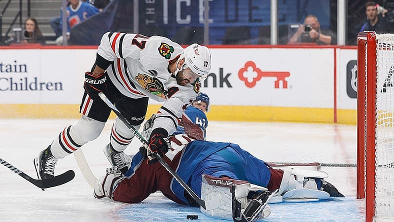 Oct 19, 2023; Denver, Colorado, USA; Colorado Avalanche goaltender Alexandar Georgiev (40) makes a save against Chicago Blackhawks left wing Nick Foligno (17) in the first period at Ball Arena. Mandatory Credit: Isaiah J. Downing-USA TODAY Sports