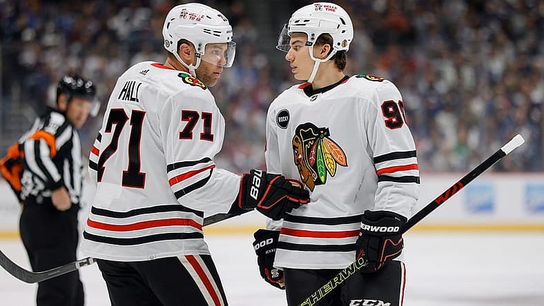 Oct 19, 2023; Denver, Colorado, USA; Chicago Blackhawks left wing Taylor Hall (71) talks with center Connor Bedard (98) in the first period against the Colorado Avalanche at Ball Arena. Mandatory Credit: Isaiah J. Downing-USA TODAY Sports