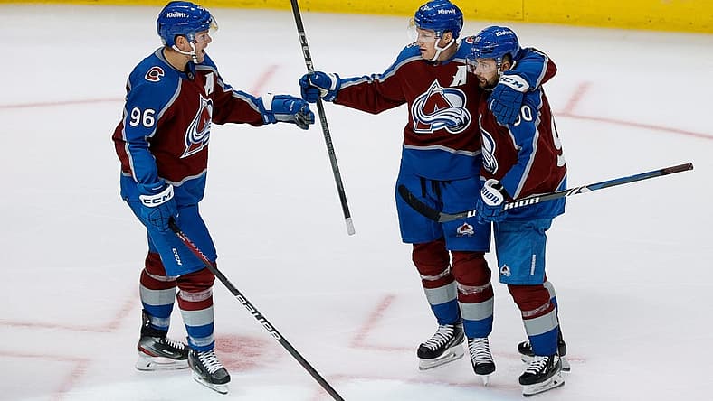Oct 19, 2023; Denver, Colorado, USA; Colorado Avalanche center Nathan MacKinnon (29) celebrates his goal with right wing Mikko Rantanen (96) and left wing Tomas Tatar (90) in the third period against the Chicago Blackhawks at Ball Arena. Mandatory Credit: Isaiah J. Downing-USA TODAY Sports