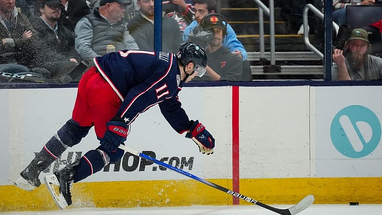 Oct 20, 2023; Columbus, Ohio, USA;  Columbus Blue Jackets center Adam Fantilli (11) leaps as he plays the puck against the Calgary Flames in the second period at Nationwide Arena. Mandatory Credit: Aaron Doster-USA TODAY Sports