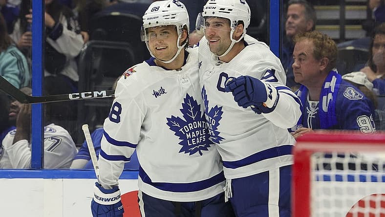 Oct 21, 2023; Tampa, Florida, USA; Toronto Maple Leafs center John Tavares (91) celebrates with Toronto Maple Leafs right wing William Nylander (88) after scoring a goal in overtime against the Tampa Bay Lightning at Amalie Arena. Mandatory Credit: Nathan Ray Seebeck-USA TODAY Sports