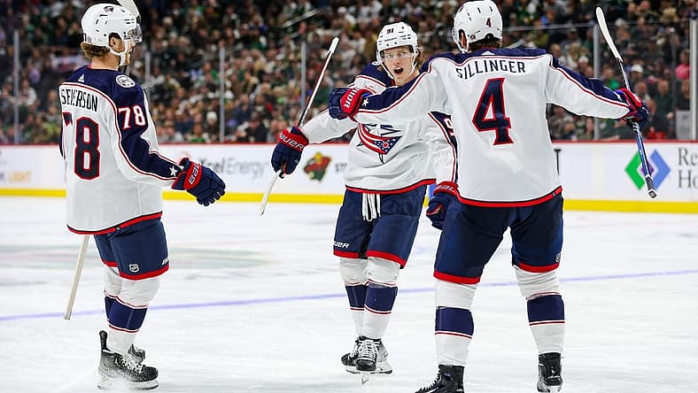 Oct 21, 2023; Saint Paul, Minnesota, USA; Columbus Blue Jackets center Kent Johnson (91) celebrates his goal against the Minnesota Wild with teammates center Cole Sillinger (4) and defenseman Damon Severson (78) during the second period at Xcel Energy Center. Mandatory Credit: Matt Krohn-USA TODAY Sports