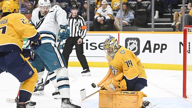 Oct 21, 2023; Nashville, Tennessee, USA; Nashville Predators goaltender Juuse Saros (74) blocks the shot of San Jose Sharks left wing Anthony Duclair (10) during the second period at Bridgestone Arena. Mandatory Credit: Steve Roberts-USA TODAY Sports