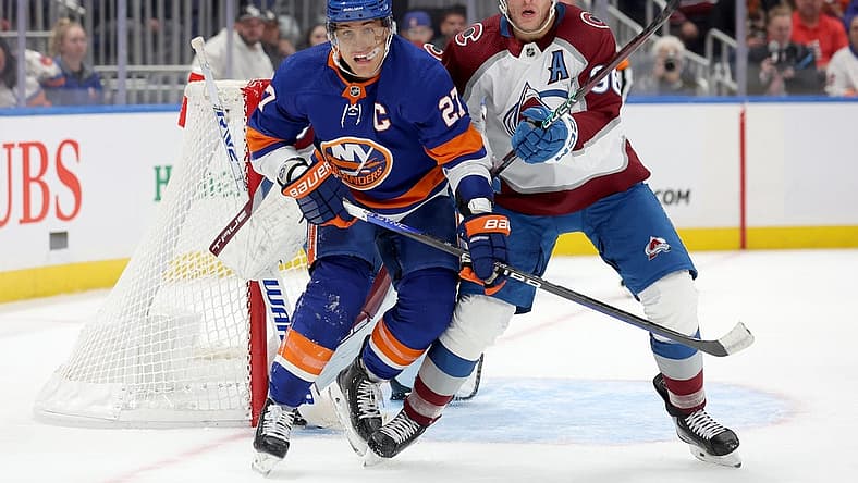 Oct 24, 2023; Elmont, New York, USA; New York Islanders left wing Anders Lee (27) fights for position against Colorado Avalanche right wing Mikko Rantanen (96) during the second period at UBS Arena. Mandatory Credit: Brad Penner-USA TODAY Sports