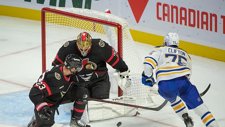 Oct 24, 2023; Ottawa, Ontario, CAN; Ottawa Senators goalie Joonas Korpisalo (70) makes a save on a shot from Buffalo Sabres defenseman Connor Clifton (75) in the third period at the Canadian Tire Centre. Mandatory Credit: Marc DesRosiers-USA TODAY Sports