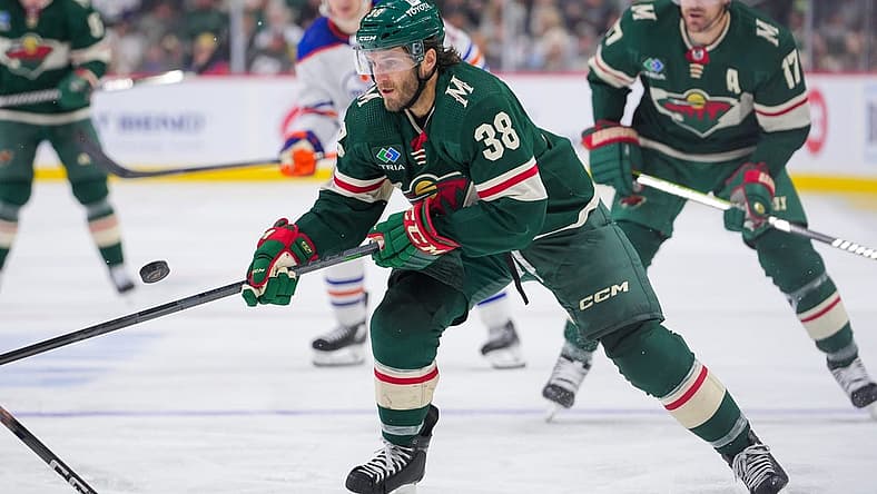 Oct 24, 2023; Saint Paul, Minnesota, USA; Minnesota Wild right wing Ryan Hartman (38) skates after the puck against the Edmonton Oilers in the second period at Xcel Energy Center. Mandatory Credit: Brad Rempel-USA TODAY Sports