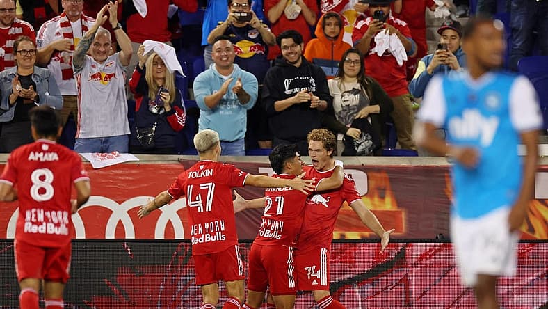 Oct 25, 2023; Harrison, NJ, USA; New York Red Bulls forward Tom Barlow (74) celebrates with midfielder Omir Fernandez (21) after scoring a goal against Charlotte FC during the second half in the Eastern Conference Wild Card match of the 2023 MLS Cup Playoffs at Red Bull Arena. Mandatory Credit: Vincent Carchietta-USA TODAY Sports