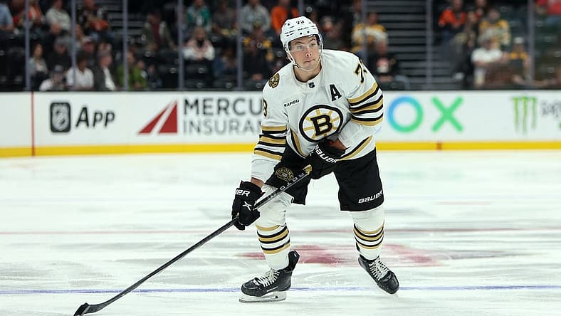 Oct 22, 2023; Anaheim, California, USA; Boston Bruins defenseman Charlie McAvoy (73) skates with the puck during the NHL game against the Anaheim Ducks at Honda Center. Mandatory Credit: Kiyoshi Mio-USA TODAY Sports