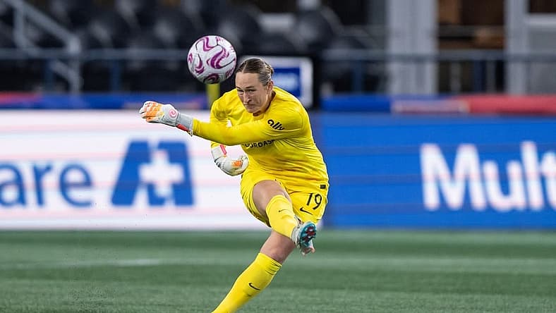 Oct 20, 2023; Seattle, Washington, USA; Angel City FC goalkeeper Angelina Anderson (19) clears the ball against OL Reign at Lumen Field. Mandatory Credit: Stephen Brashear-USA TODAY Sports