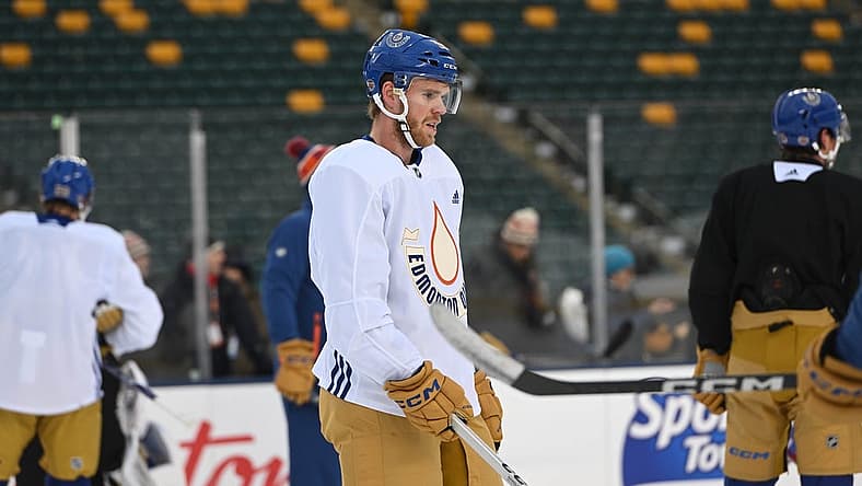 Oct 28, 2023; Edmonton, Alberta, Canada; EEdmonton Oilers centre Connor McDavid (97) hits the ice during practice day for the 2023 Heritage Classic ice hockey game at Commonwealth Stadium. Mandatory Credit: Walter Tychnowicz-USA TODAY Sports