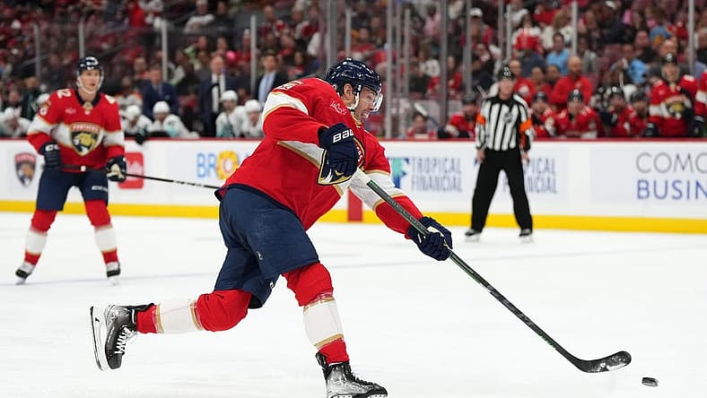 Oct 28, 2023; Sunrise, Florida, USA; Florida Panthers center Carter Verhaeghe (23) shoots the puck against the Seattle Kraken during the second period at Amerant Bank Arena. Mandatory Credit: Jasen Vinlove-USA TODAY Sports