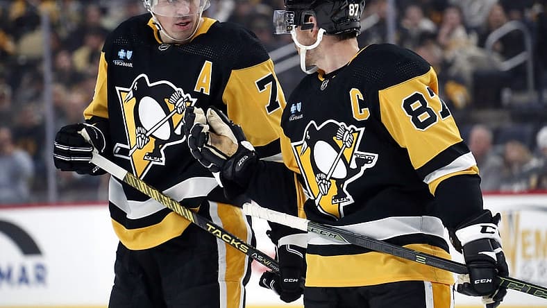 Oct 28, 2023; Pittsburgh, Pennsylvania, USA; Pittsburgh Penguins center Evgeni Malkin (71) listens to center Sidney Crosby (87) prior to a face-off against the Ottawa Senators during the first period at PPG Paints Arena. Mandatory Credit: Charles LeClaire-USA TODAY Sports