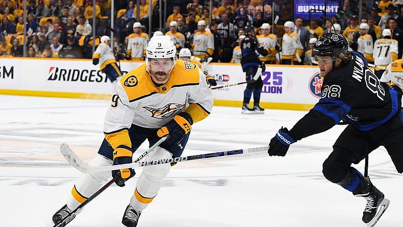 Oct 28, 2023; Nashville, Tennessee, USA; Nashville Predators left wing Filip Forsberg (9) skates the puck into the offensive zone against Toronto Maple Leafs right wing William Nylander (88) during the first period at Bridgestone Arena. Mandatory Credit: Christopher Hanewinckel-USA TODAY Sports