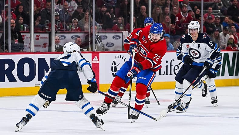 Oct 28, 2023; Montreal, Quebec, CAN; Montreal Canadiens defenseman Arber Xhekaj (72) plays the puck against the Winnipeg Jets during overtime at Bell Centre. Mandatory Credit: David Kirouac-USA TODAY Sports