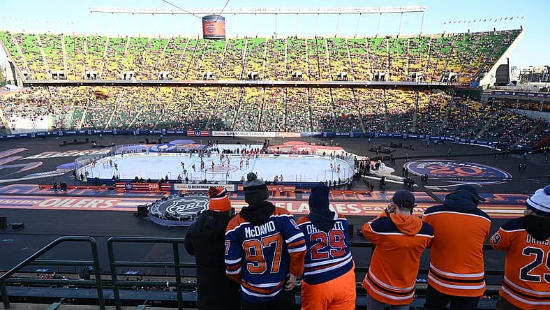 Oct 29, 2023; Edmonton, Alberta, CAN; Fans watch the pre game skate before game action of the Edmonton Oilers as they take on the Calgary Flames in the 2023 Heritage Classic ice hockey game at Commonwealth Stadium. Mandatory Credit: Walter Tychnowicz-USA TODAY Sports