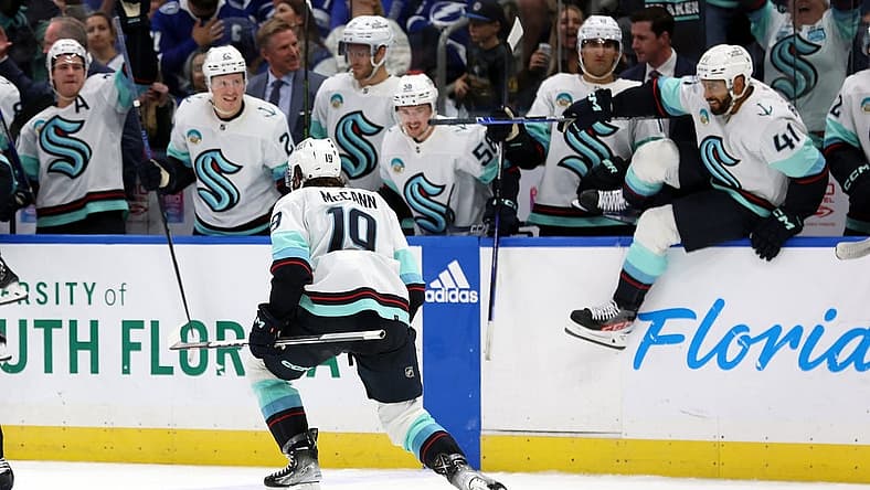 Oct 30, 2023; Tampa, Florida, USA; Seattle Kraken left wing Jared McCann (19) celebrates with teammates after they beat the Tampa Bay Lightning during overtime at Amalie Arena. Mandatory Credit: Kim Klement Neitzel-USA TODAY Sports