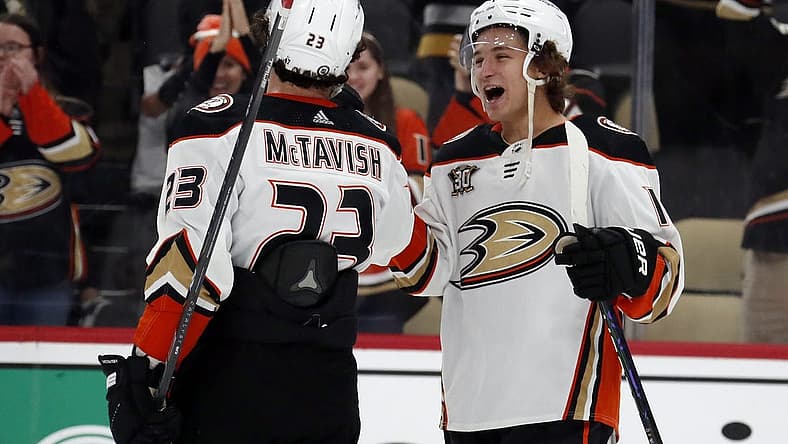 Oct 30, 2023; Pittsburgh, Pennsylvania, USA;  Anaheim Ducks center Mason McTavish (23) and center Trevor Zegras (right) celebrate after defeating the Pittsburgh Penguins at PPG Paints Arena.  Anaheim won 4-3. Mandatory Credit: Charles LeClaire-USA TODAY Sports