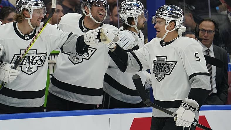 Oct 31, 2023; Toronto, Ontario, CAN; Los Angeles Kings defenseman Andreas Englund (5) gets congratulated after scoring against the Toronto Maple Leafs during the first period at Scotiabank Arena. Mandatory Credit: John E. Sokolowski-USA TODAY Sports