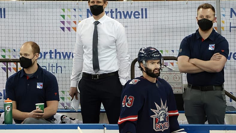 Mar 17, 2021; New York, New York, USA; Handling coaching duties for the New York Rangers against the Philadelphia Flyers are Hartford Wolf Pack head coach Kris Knoblauch (seen here watching warm-ups) and Wolf Pack associate head coach Gord Murphy and Rangers associate general manager Chris Drury at Madison Square Garden. Due to the NHL COVID-10 protocol, the Rangers coaching staff were not available for tonights game. Mandatory Credit: Bruce Bennett/POOL PHOTOS-USA TODAY Sports
