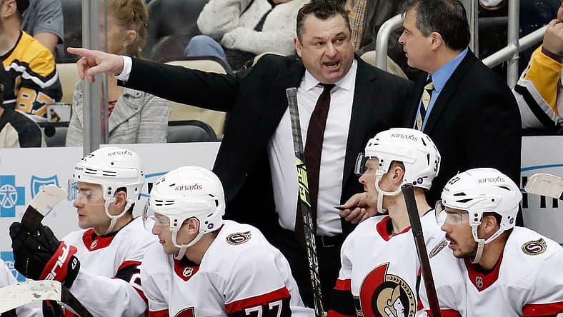 Mar 20, 2023; Pittsburgh, Pennsylvania, USA; Ottawa Senators head coach D.J. Smith (left) talks with associate coach Jack Capuano (right) on the bench against the Pittsburgh Penguins at PPG Paints Arena. Mandatory Credit: Charles LeClaire-USA TODAY Sports