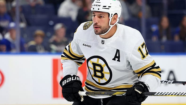 Sep 26, 2023; Buffalo, New York, USA; Boston Bruins left wing Milan Lucic (17) looks for the puck during the first period against the Buffalo Sabres at KeyBank Center. Mandatory Credit: Timothy T. Ludwig-USA TODAY Sports