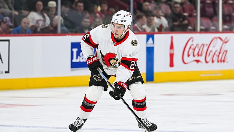 Sep 27, 2023; Montreal, Quebec, CAN; Ottawa Senators defenseman Erik Brannstrom (26) plays the puck against the Montreal Canadiens during the first period at Bell Centre. Mandatory Credit: David Kirouac-USA TODAY Sports