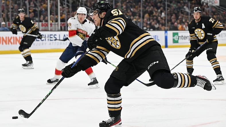 Oct 30, 2023; Boston, Massachusetts, USA; Boston Bruins center Matthew Poitras (51) takes a shot against the Florida Panthers during the first period at the TD Garden. Mandatory Credit: Brian Fluharty-USA TODAY Sports