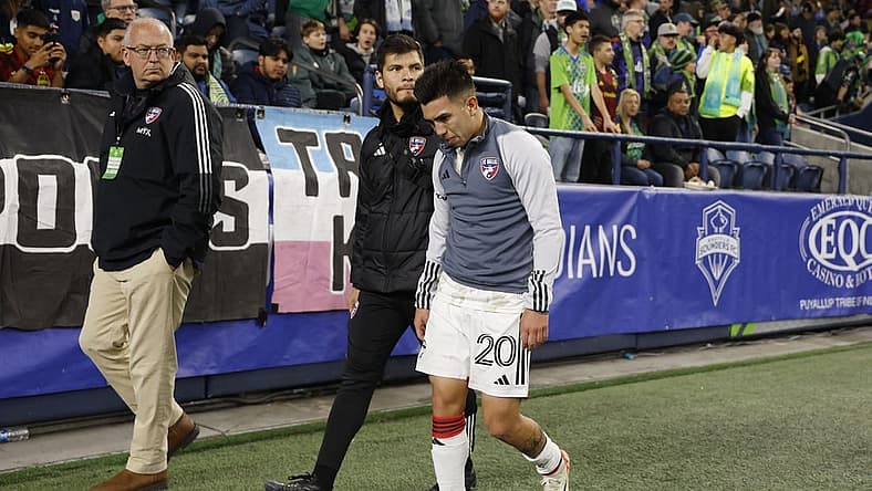 Oct 30, 2023; Seattle, Washington, USA; FC Dallas midfielder Alan Velasco (20) leaves the field after being injured in the first half against the Seattle Sounders FC in game one of a round one match of the 2023 MLS Cup Playoffs at Lumen Field. Mandatory Credit: Joe Nicholson-USA TODAY Sports