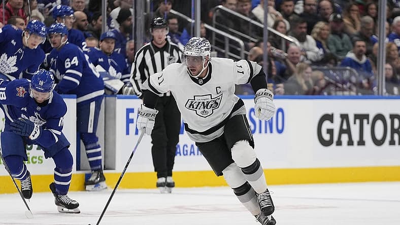 Oct 31, 2023; Toronto, Ontario, CAN; Los Angeles Kings forward Anze Kopitar (11) skates with the puck against the Toronto Maple Leafs during the second period at Scotiabank Arena. Mandatory Credit: John E. Sokolowski-USA TODAY Sports