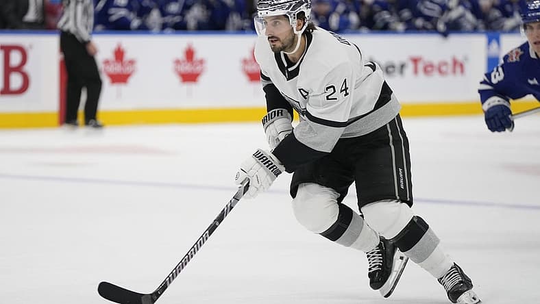 Oct 31, 2023; Toronto, Ontario, CAN; Los Angeles Kings forward Phillip Danault (24) carries the puck against the Toronto Maple Leafs during the third period at Scotiabank Arena. Mandatory Credit: John E. Sokolowski-USA TODAY Sports