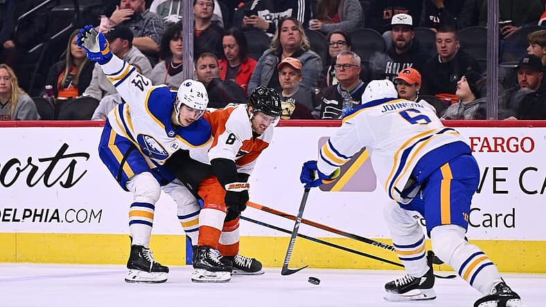 Nov 1, 2023; Philadelphia, Pennsylvania, USA; Philadelphia Flyers defenseman Cam York (8) and Buffalo Sabres center Dylan Cozens (24) battle for the puck in the first period at Wells Fargo Center. Mandatory Credit: Kyle Ross-USA TODAY Sports