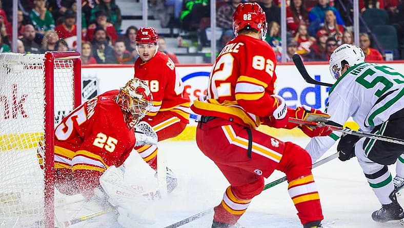 Nov 1, 2023; Calgary, Alberta, CAN; Calgary Flames goaltender Jacob Markstrom (25) makes a save against the Dallas Stars during the first period at Scotiabank Saddledome. Mandatory Credit: Sergei Belski-USA TODAY Sports