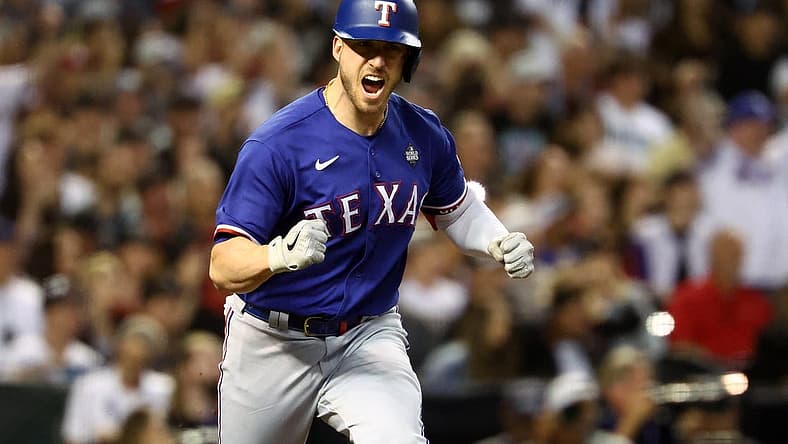 Nov 1, 2023; Phoenix, Arizona, USA; Texas Rangers catcher Mitch Garver (18) reacts after hitting a RBI single against the Arizona Diamondbacks during the sixth inning in game five of the 2023 World Series at Chase Field. Mandatory Credit: Mark J. Rebilas-USA TODAY Sports