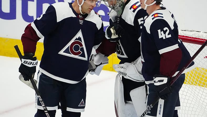 Nov 1, 2023; Denver, Colorado, USA; Colorado Avalanche goaltender Ivan Prosvetov (50) and defenseman Jack Johnson (3) and defenseman Josh Manson (42) celebrate the win over the St. Louis Blues in the second period at Ball Arena. Mandatory Credit: Ron Chenoy-USA TODAY Sports
