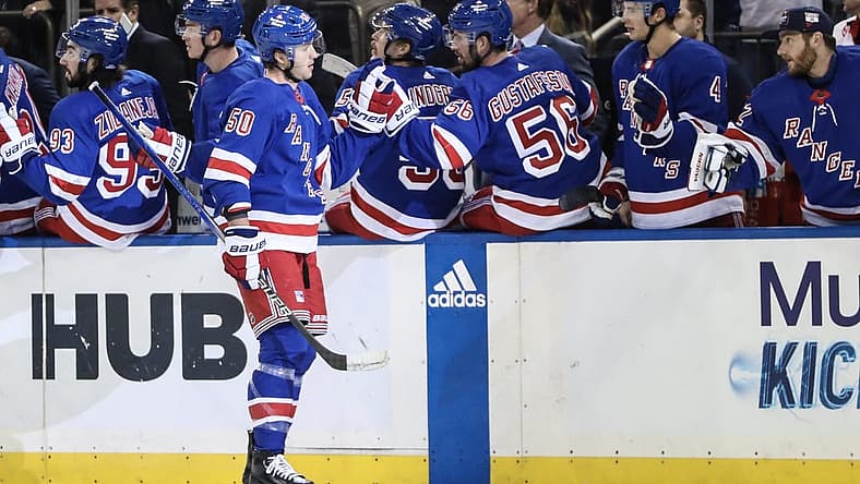 Nov 2, 2023; New York, New York, USA; New York Rangers left wing Will Cuylle (50) celebrates with his teammates after scoring a goal in the third period against the Carolina Hurricanes at Madison Square Garden. Mandatory Credit: Wendell Cruz-USA TODAY Sports