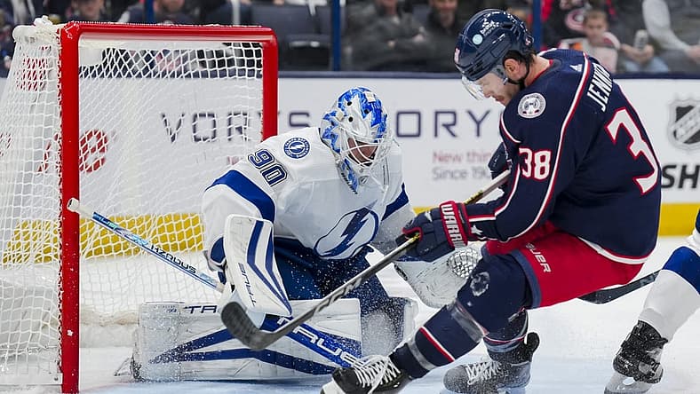 Nov 2, 2023; Columbus, Ohio, USA; Tampa Bay Lightning goaltender Matt Tomkins (90) defends the net against Columbus Blue Jackets center Boone Jenner (38) in the third period at Nationwide Arena. Mandatory Credit: Aaron Doster-USA TODAY Sports