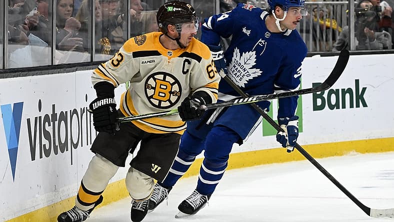 Nov 2, 2023; Boston, Massachusetts, USA; Boston Bruins left wing Brad Marchand (63) skates against Toronto Maple Leafs defenseman Morgan Rielly (44) during the third period at the TD Garden. Mandatory Credit: Brian Fluharty-USA TODAY Sports