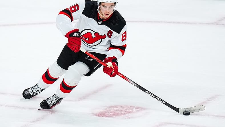 Nov 2, 2023; Saint Paul, Minnesota, USA; New Jersey Devils center Jack Hughes (86) carries the puck during the third period against the Minnesota Wild at Xcel Energy Center. Mandatory Credit: Brace Hemmelgarn-USA TODAY Sports