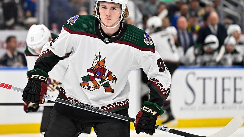 Oct 19, 2023; St. Louis, Missouri, USA;  Arizona Coyotes center Logan Cooley (92) waits for a face off against the St. Louis Blues during the first period at Enterprise Center. Mandatory Credit: Jeff Curry-USA TODAY Sports