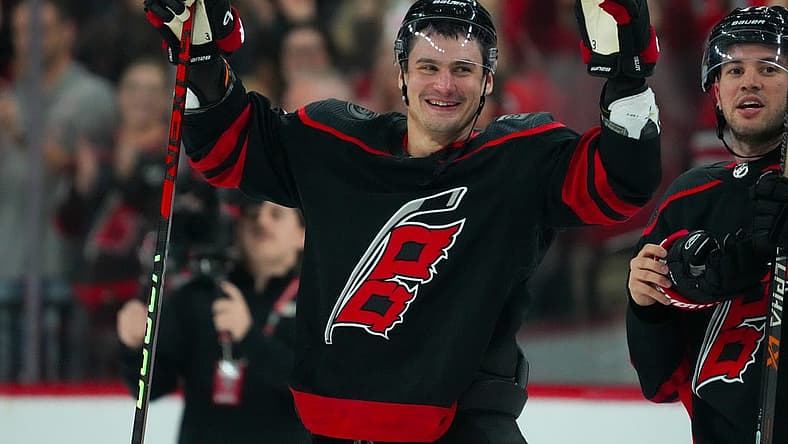 Oct 27, 2023; Raleigh, North Carolina, USA; Carolina Hurricanes defenseman Dmitry Orlov (7) celebrate their victory against the San Jose Sharks after the game at PNC Arena. Mandatory Credit: James Guillory-USA TODAY Sports